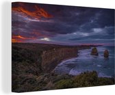 Canvas Schilderij De Twaalf Apostelen bij rode zonsondergang in Australië - 90x60 cm - Wanddecoratie