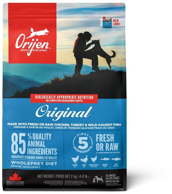 Orijen Original hondenvoer zak met een afbeelding van een persoon met een hond. 85% dierlijke ingrediënten.
