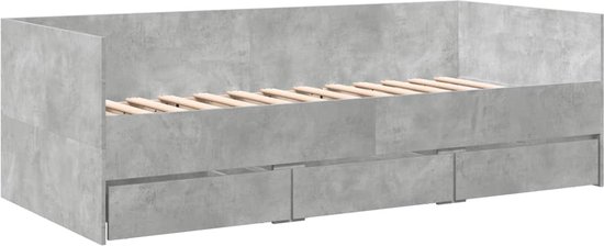 Betongrijze slaapbank met houten lattenbodem en drie lades, zijaanzicht.