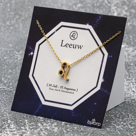 Gouden ketting met leeuw-symbool op een kaart met de tekst 'Leeuw' en datums.
