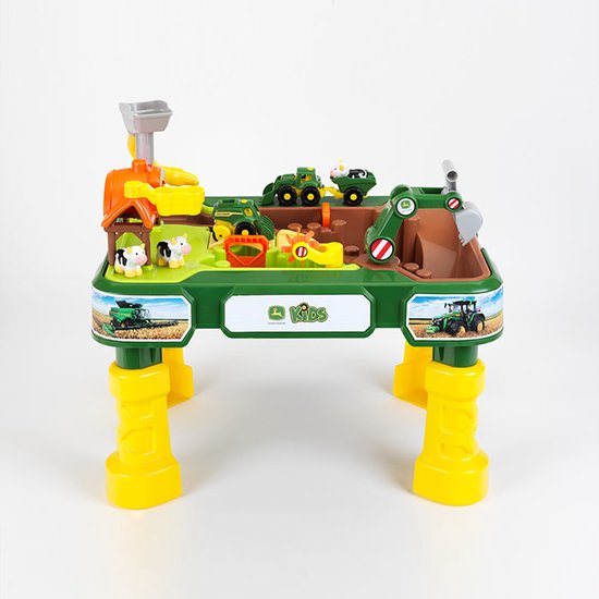 Een John Deere boerderij speeltafel met groene en gele elementen, inclusief kleine tractoren en dieren.