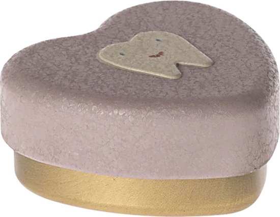 Boîte de rangement en forme de cœur rose pâle avec bordure dorée et une dent de dessin animé avec un visage.