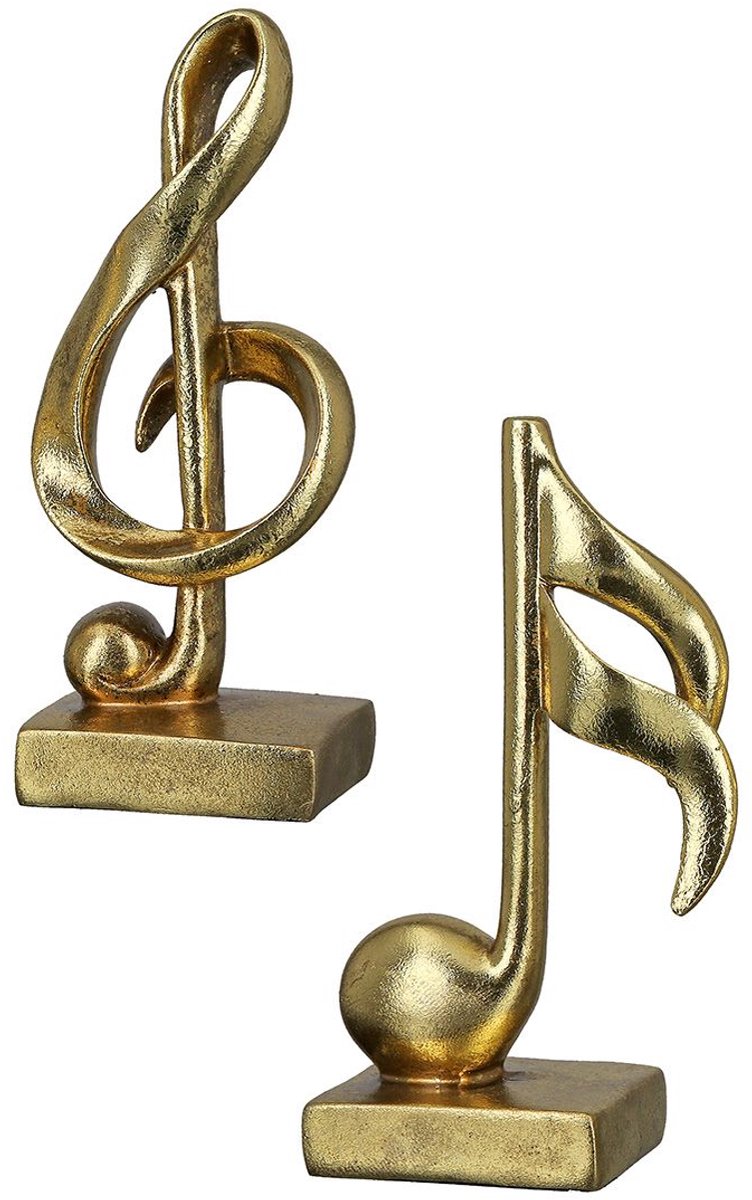 muzieksleutel en muzieknoot goud