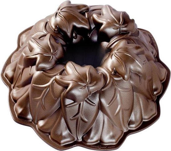 Bronzen tulbandvorm met herfstbladeren en een centraal gat.