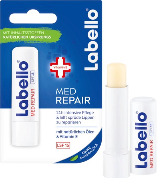 Labello Med Repair lippenbalsem met SPF 15 in verpakking. Naast de verpakking ligt een open lippenbalsem.