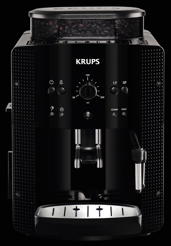 Zwarte Krups volautomaat espressomachine met een glas espresso.