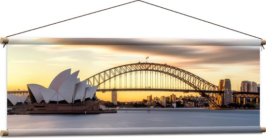 Textielposter - Zonsondergang achter de Brug in Sydney, Australië - 120x40 cm Foto op Textiel