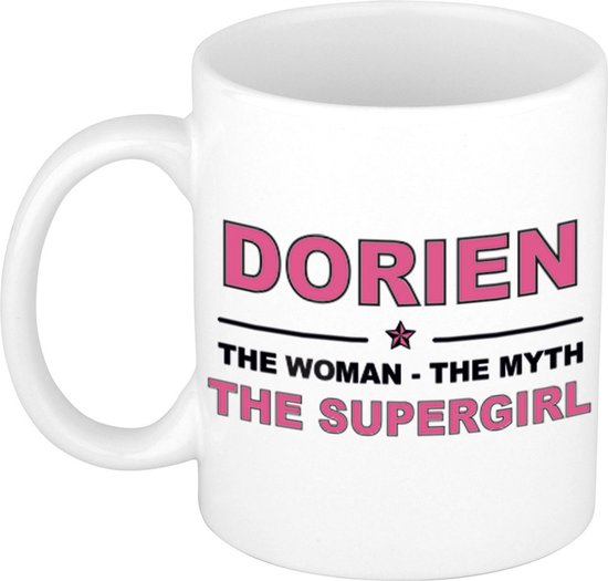 Witte mok met de tekst "DORIEN THE WOMAN - THE MYTH THE SUPERGIRL" in roze letters.