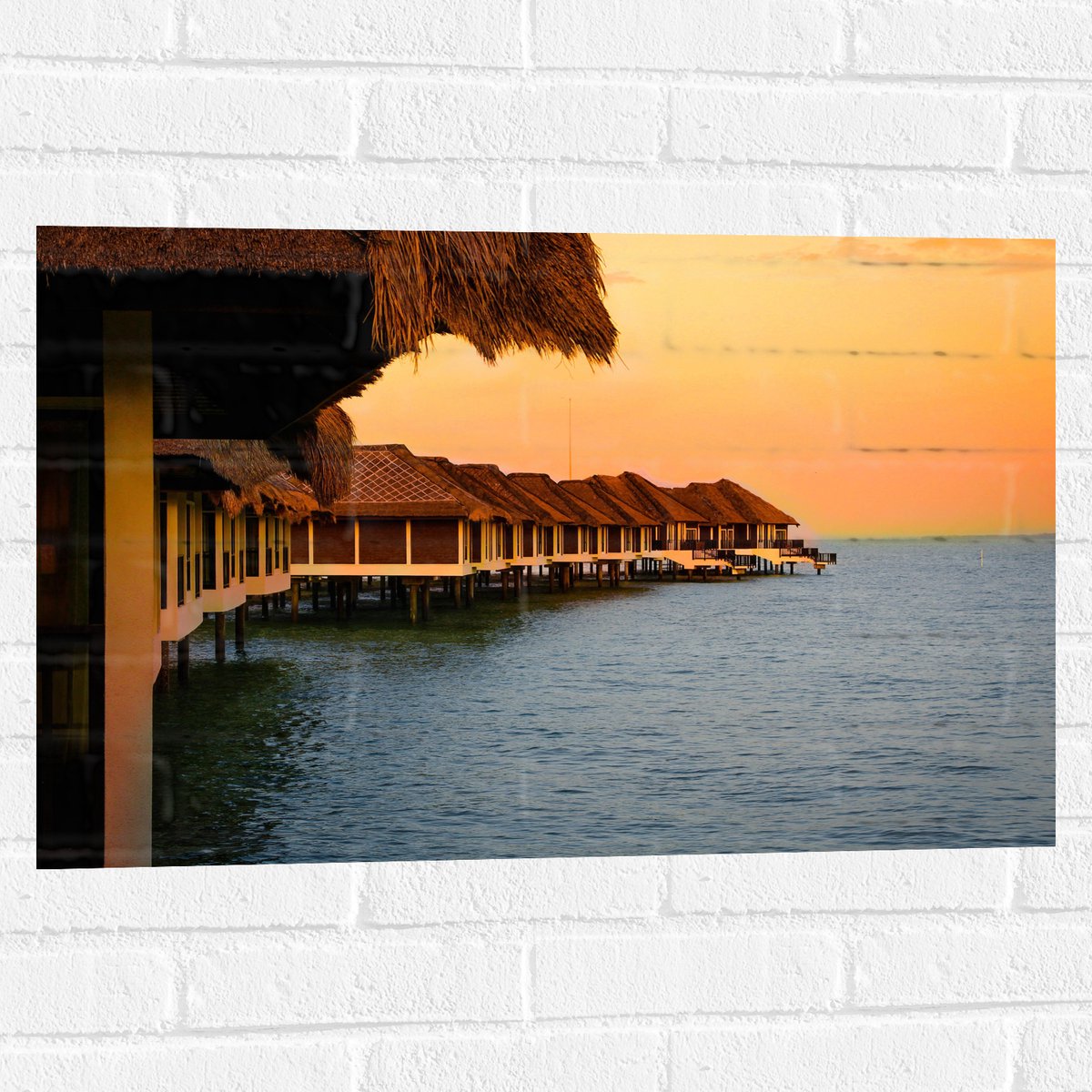 Muursticker - Huisjes op Palen in de Zee - 75x50 cm Foto op Muursticker