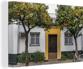 Canvas Schilderij Kleurrijke deur in het Spaanse Santa Cruz - 30x20 cm - Wanddecoratie