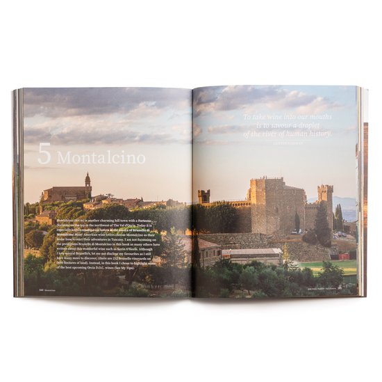 Een open boek toont een panorama van Montalcino met een fort en huizen, met de tekst 'To take wine into our mouths is to savour a droplet of the river of human history.'