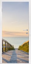 Deursticker Kalm strand in Duitsland bij zonsondergang - 75x205 cm - Deurposter