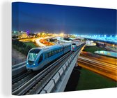 Un chemin de fer avec un train pendant la nuit Toile 120x80 cm - Tirage photo sur toile (Décoration murale salon / chambre)