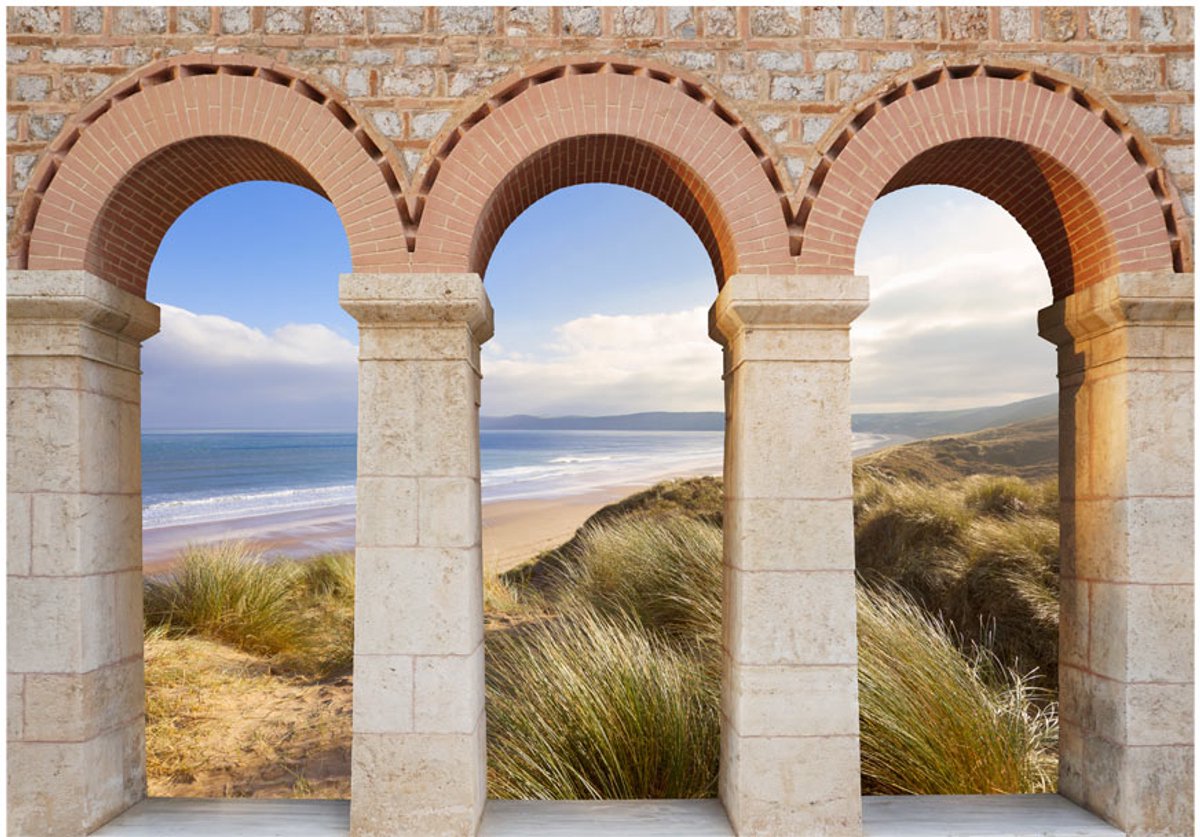 Fotobehangkoning - Behang - Vliesbehang - Fotobehang Uitzicht op het Strand door de Romeinse Pilaren 3D - 400 x 280 cm