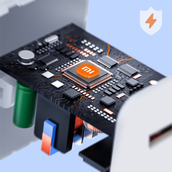 Gros plan détaillé de l'intérieur d'un chargeur blanc Xiaomi montrant la puce 'mi'.