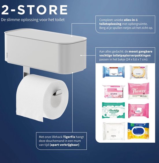 Porte-rouleau toilette blanc Tiger 2-Store avec bac de rangement, à côté d'un rouleau toilette. Le bac accueille des lingettes de 24x9.6x7cm.