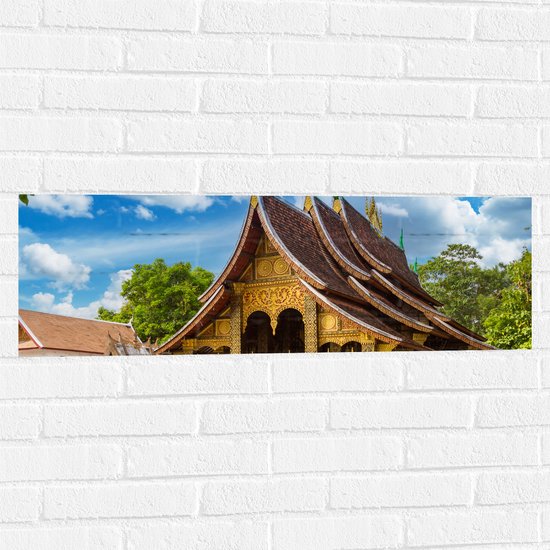 Muursticker - Goud met Bruine Wat Xiengthong Tempel in Luang Pabrang, Laos - 90x30 cm Foto op Muursticker