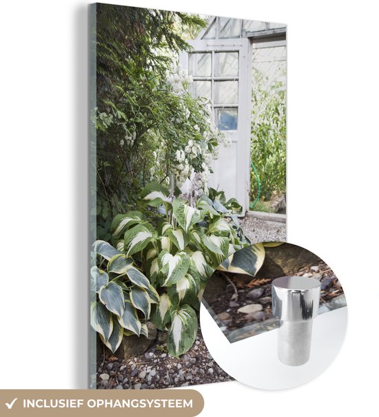 MuchoWow® Glasschilderij - Hartlelies in een lichte tuinkas - 60x90 cm - Acrylglas Schilderijen - Foto op Glas