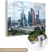 MuchoWow® Glasschilderij 60x40 cm - Schilderij acrylglas - Het stadslandschap van Moskou in Rusland met wolkenkrabbers - Foto op glas - Schilderijen
