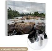 MuchoWow® Glasschilderij 90x60 cm - Schilderij acrylglas - Rotsen in de rivier van Suriname - Foto op glas - Schilderijen