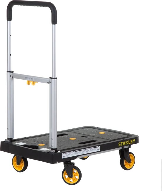 Zwarte Stanley platte handwagen met aluminium uitschuifbaar handvat en gele wielaccenten.