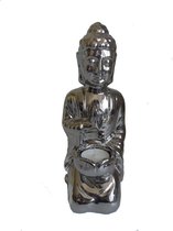 Boeddha beeld waxinelicht theelicht  houder knielend zilverkleur hoogte 27 cm lengte 10 cm breedte 10 cm.