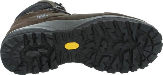 Onderkant van een bruine Hanwag wandelschoen met een zwarte Vibram zool met diep profiel.