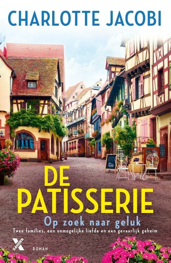 Boekcover van De Patisserie: Op zoek naar geluk door Charlotte Jacobi. Een straat met kleurrijke huizen.