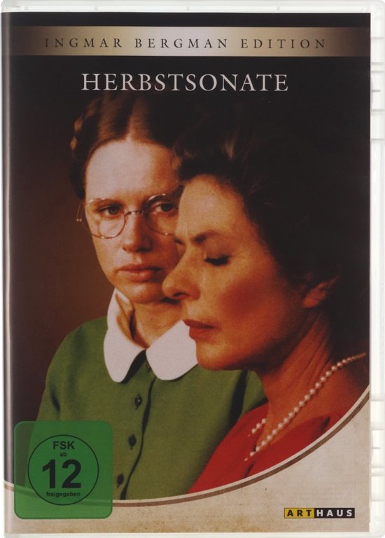 De DVD-hoes toont twee vrouwen. Links een vrouw met bril, groene jurk met witte kraag. Rechts een vrouw met parelketting en rode top.