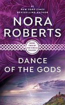 Boek 'Dance of the Gods' van Nora Roberts, deel twee van de Circle trilogie. Paarse achtergrond met een stormachtige zee en bliksem.