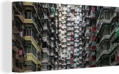 Canvas Schilderij Verlaten flatgebouwen in Hong Kong - 80x40 cm - Wanddecoratie