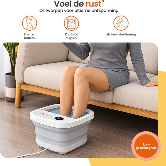 Vrouw met grijze jurk zit op een bank en dompelt haar voeten in een wit en grijs voetenbad met bubbels en een digitaal display.
