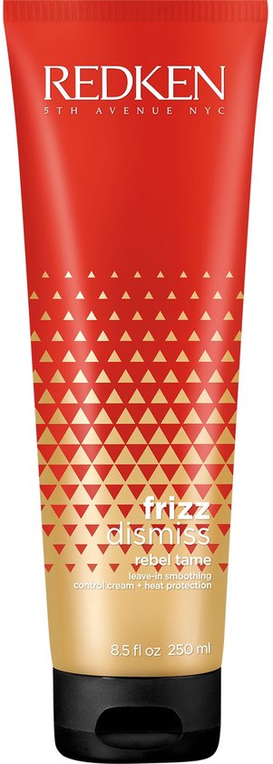 Een rode tube met gouden geometrische driehoeken, tekst 'REDKEN frizz dismiss rebel tame leave-in smoothing control cream heat protection'.