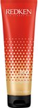 Een rode tube met gouden geometrische driehoeken, tekst 'REDKEN frizz dismiss rebel tame leave-in smoothing control cream heat protection'.