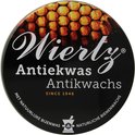 Zwarte deksel met "Wiertz Antiekwas" en afbeelding van honingraten.