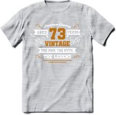 73 Jaar Legend T-Shirt | Goud - Wit | Grappig Verjaardag en Feest Cadeau Shirt | Dames - Heren - Unisex | Tshirt Kleding Kado | - Licht Grijs - Gemaleerd - S
