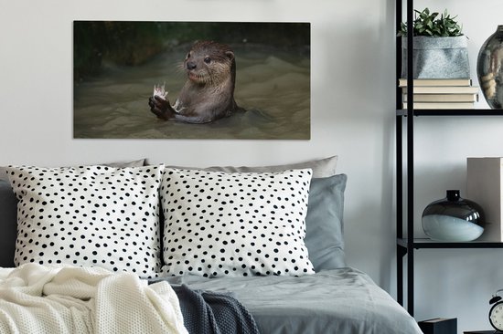 Tableau sur toile Loutre avec de la nourriture dans l'eau - 80x40 cm - Décoration murale