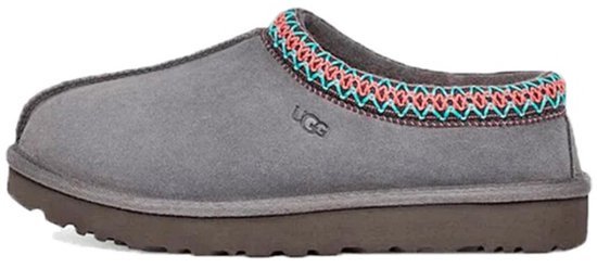 Grijze UGG pantoffel met decoratieve oranje en turquoise rand.