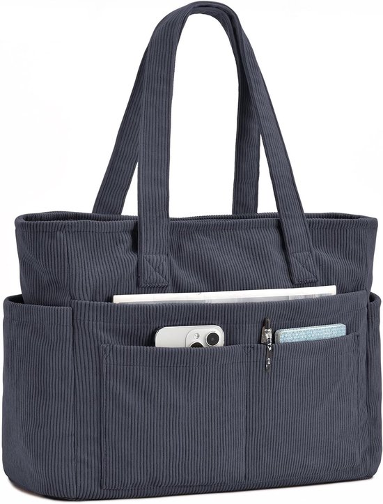 Sac fourre-tout en velours côtelé bleu foncé avec anses et poches extérieures contenant un téléphone, des stylos et un bloc-notes.