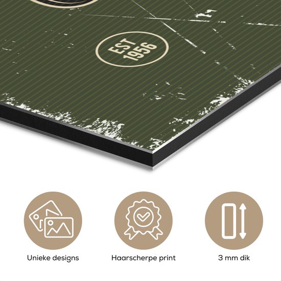 Détail d'une toile verte avec 'Est 1956' et icônes 'Designs uniques', 'Impression haute définition', '3 mm d'épaisseur'.