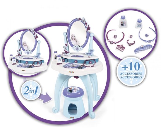 Een witte speelgoedkaptafel met blauwe pootjes, een spiegel met Frozen-decoratie en accessoires. Twee cirkels tonen de '2-in-1' functie en de accessoires.