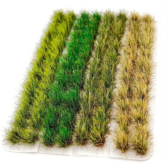 Rechthoekige matten met modelgras in verschillende tinten groen en beige, klaar om te gebruiken.