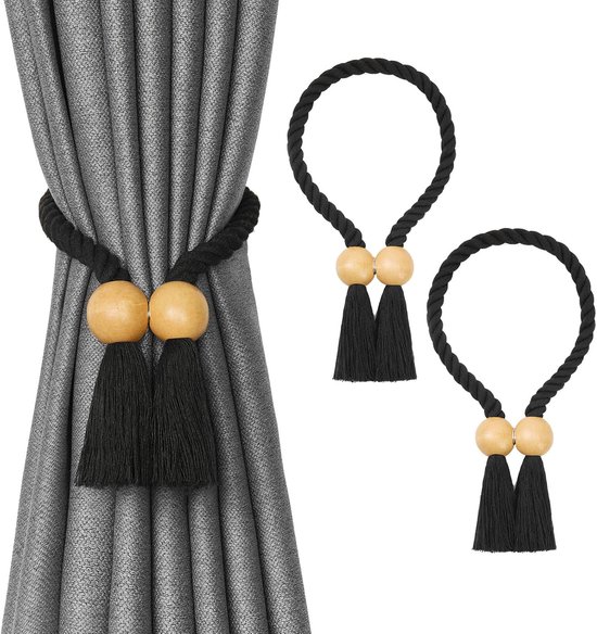 Rideaux gris maintenus par une embrasse en corde noire avec deux billes en bois et pompons noirs. Deux embrasses détachées sont à côté.