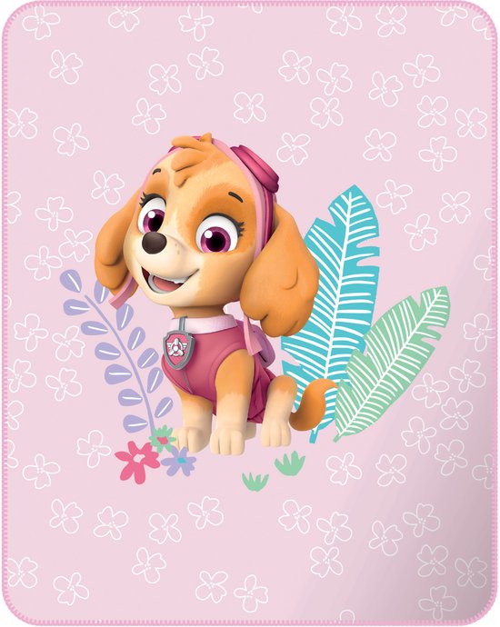 Roze deken met Skye van PAW Patrol, omringd door bloemen en bladeren.