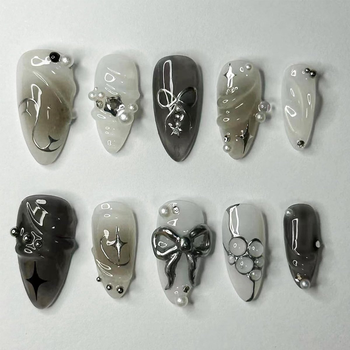aladdien - Press Nails - Zwarte Nagels - Met 3D Metaal Strik en Parels - 24-delig - Medium Almond - Herbruikbare Valse Nagels - Geschikt voor Nagelv...