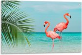 Tuinposter – Twee Flamingo's in Zee met Palmblad - 90x60cm Foto op Tuinposter  (wanddecoratie voor buiten en binnen)
