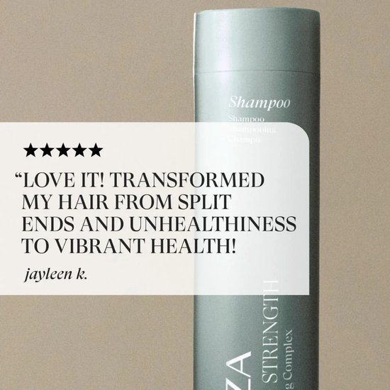 Pastelgroene L'ANZA Healing Strength Shampoo fles met een klantbeoordeling: 'LOVE IT! TRANSFORMEED MY HAIR...'.