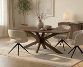 Ovale eettafel van donker hout met kruisvormig onderstel, omringd door vier stoffen eetkamerstoelen in een lichte kleur.