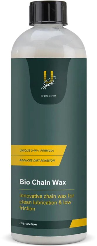 Donkergroene fles met witte inhoud en gele opdruk, op een zwarte achtergrond.