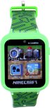Groen Minecraft smartwatch met pixelpatroon bandje. Scherm toont camera-, video-, stappenteller- en albumviewer-icoontjes.